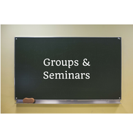 A photo of a blackboard with the words Groups and Seminars written on it.